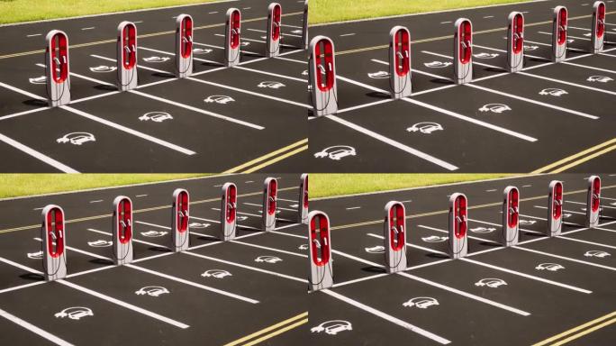鸟瞰图在一个没有品牌的户外电动汽车充电设施与红色的汽车充电器