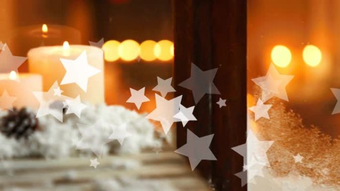 圣诞节时星星掉落在蜡烛和窗户上的动画