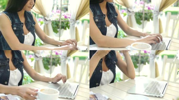 年轻微笑的女人在笔记本电脑上打字，喝杯咖啡