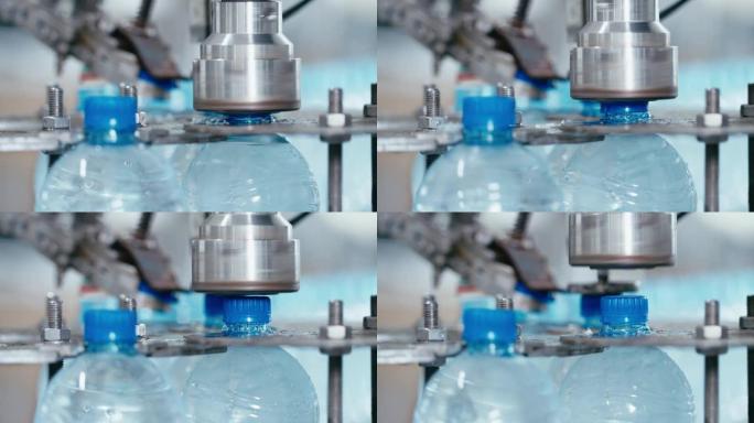 水厂工业机器在带水的塑料pet瓶上盖上盖子，特写