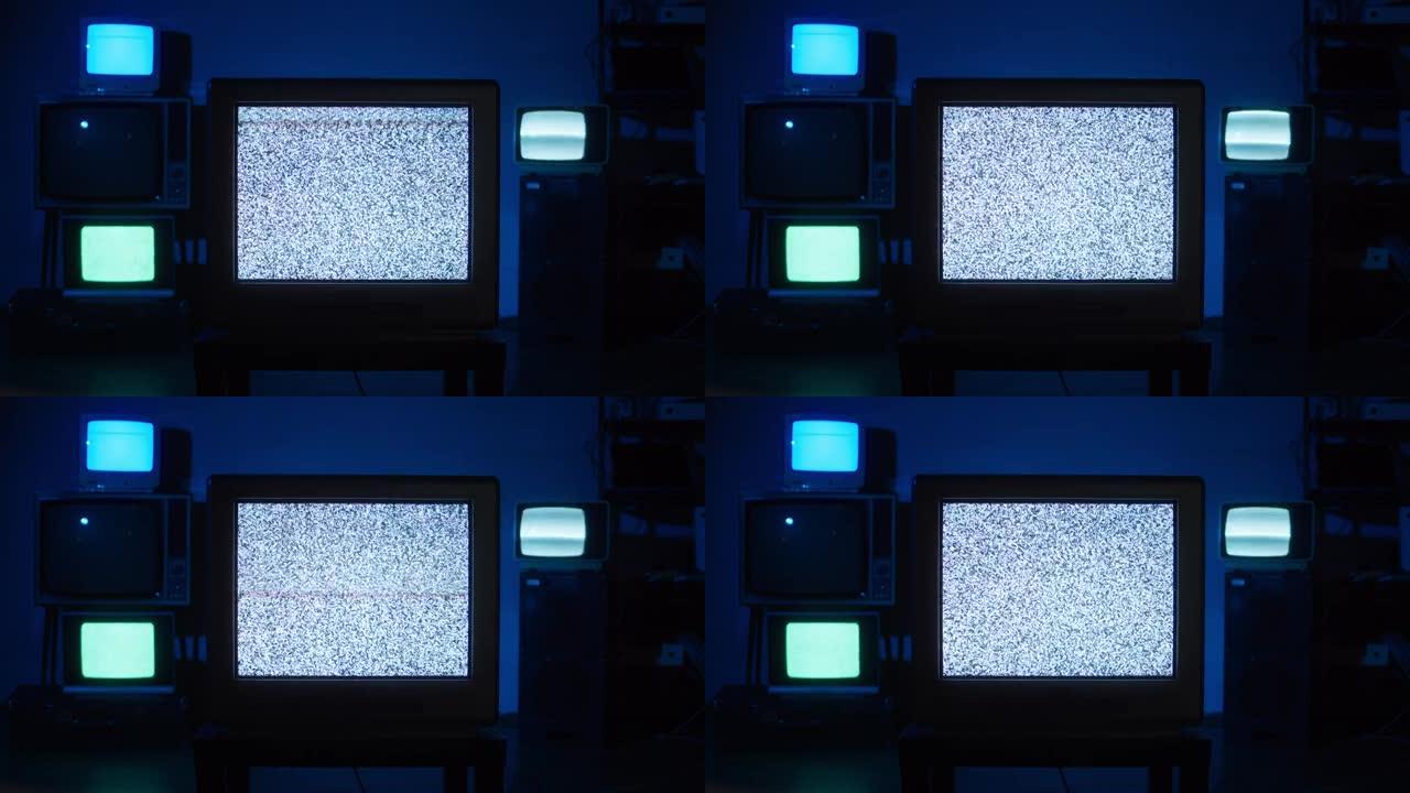 蓝色霓虹灯背景的复古旧电视。收集古老的老式电视，带有灰屏，信号接收不良，波纹和干扰，摄影概念