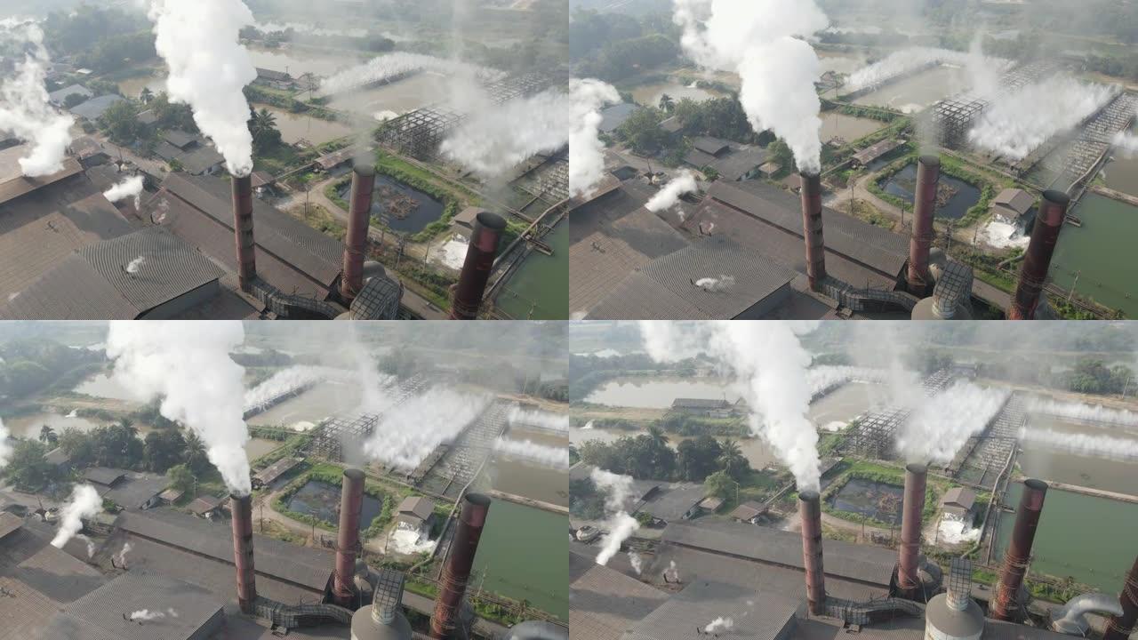 工厂烟囱冒烟的鸟瞰图，制糖厂的空气污染