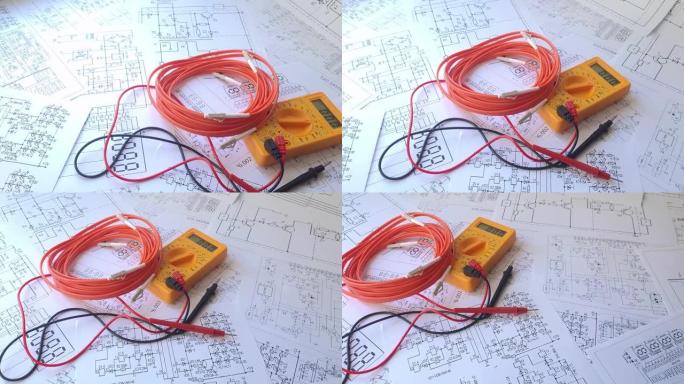 电气工程图纸上的光纤跳线电缆和数字万用表
