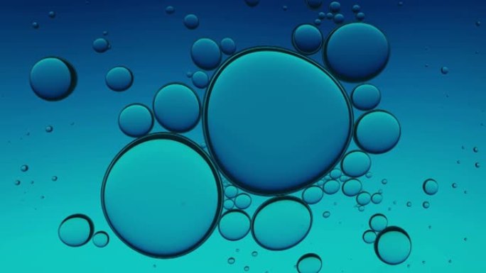 蓝色紫色油滴抽象背景。水无缝回路中油气泡的有机质地。