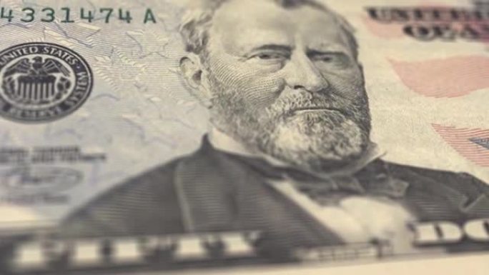 多莉拍摄的照片显示了100美元、50美元、20美元、10美元、5美元、1美元钞票的极端细节视频