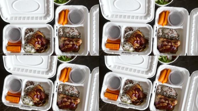 从餐厅外卖减肥食品。白色回收纸盒中的健康食品