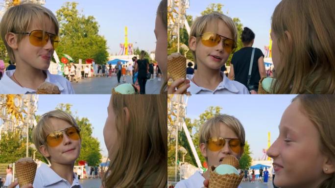 一个男孩和一个金发女孩在游乐园里吃冰淇淋。在年度博览会上快乐的青少年童年。儿童摄入过多的糖会导致糖尿