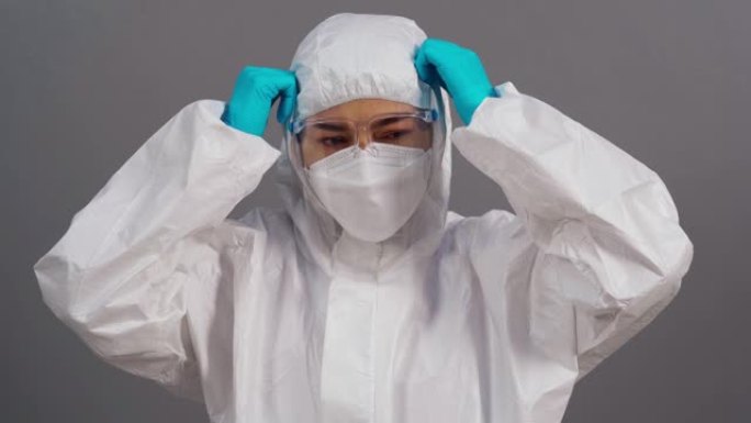 冠状病毒 (新型冠状病毒肺炎) 大流行期间穿着防护服的压力医生