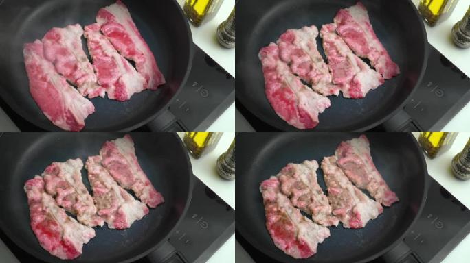 牛肉培根在平底锅中煎炸大理石薄牛肉