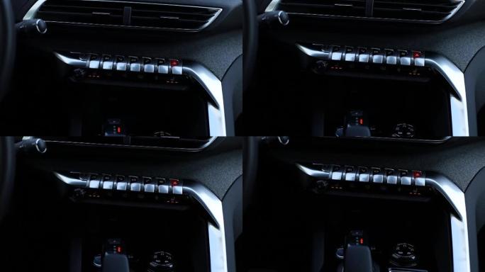 从上到下平移。现代汽车中的气候控制按钮面板。