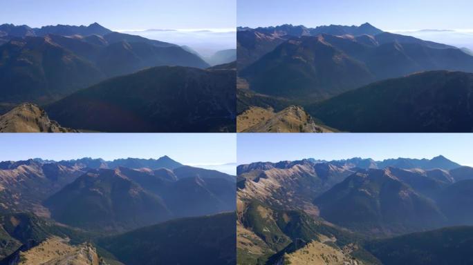 在Ciemniak的圆形山峰上飞行，秋天可以欣赏塔特拉山脉的深远景色。4k镜头