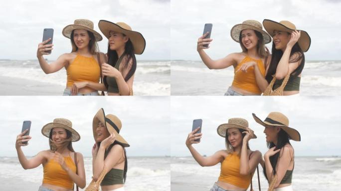 快乐的女人在海滩上的智能手机上分享美好的记忆图片
