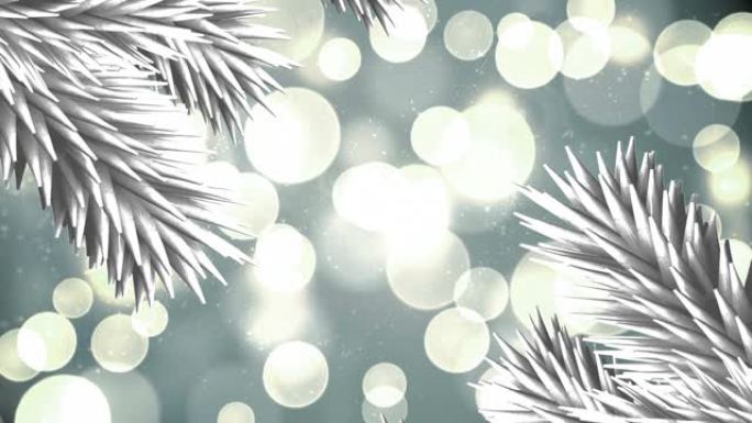 白色圣诞树树枝在灰色背景下的灯光斑点上