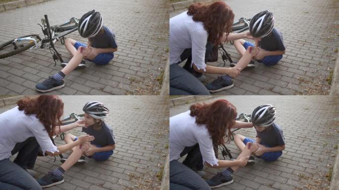 从自行车上摔下来后受伤的男孩