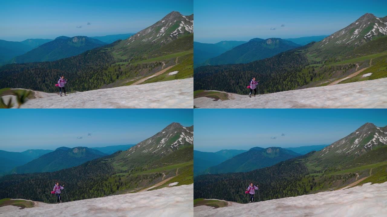 爬山，独自一个女背包客在山顶攀登