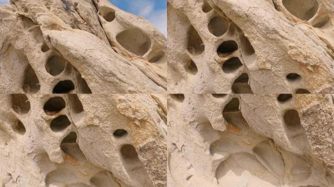 犹他州魔鬼游乐场的花岗岩岩石上形成的洞