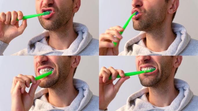 戴牙套的高加索人在浅色背景上用牙刷刷牙