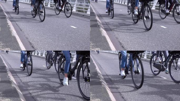 骑自行车的人正在骑自行车道。慢动作