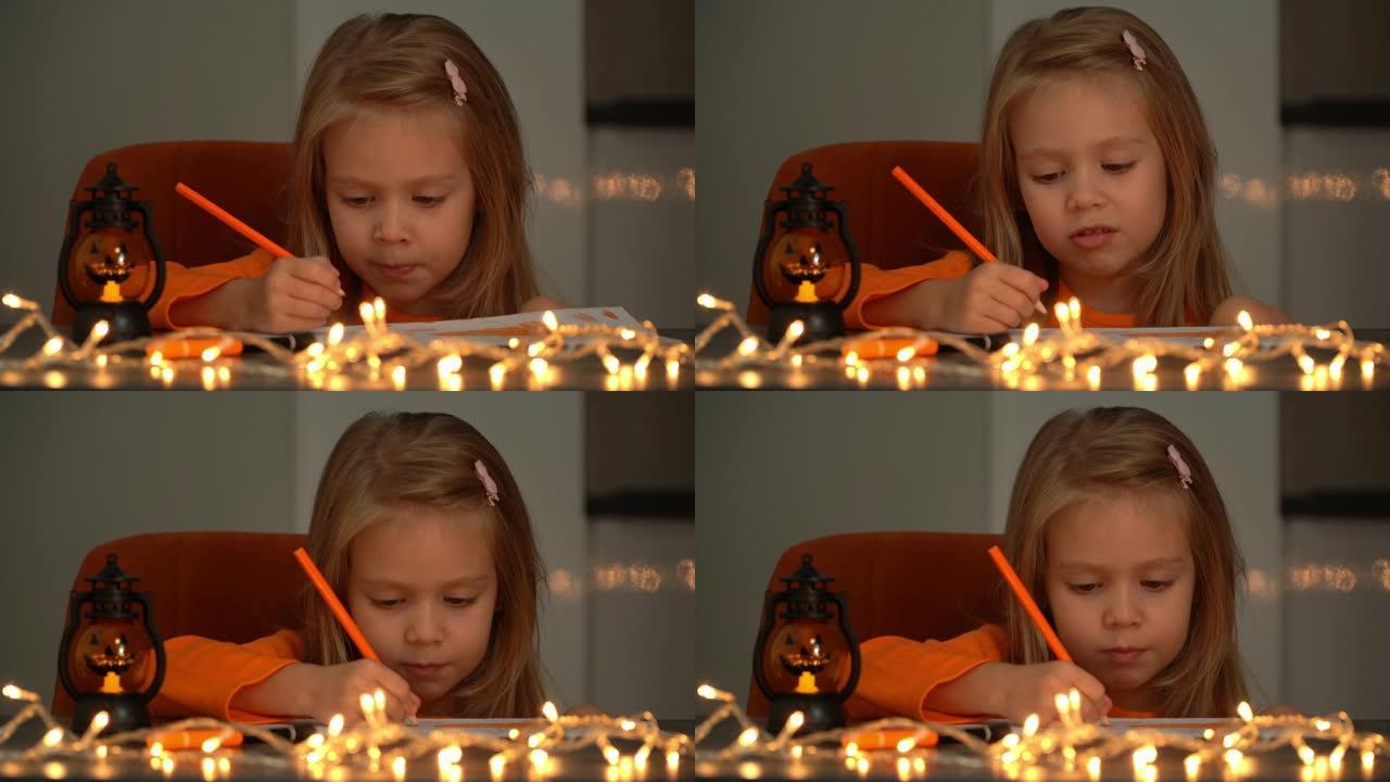 孩子坐在黑暗中，带着万圣节南瓜灯，金色的花环和橙色的铅笔。女孩为假期做装饰