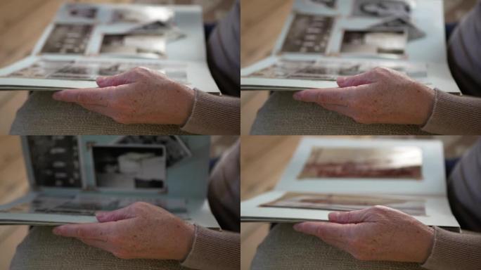 成年妇女在家里看起来像旧相册