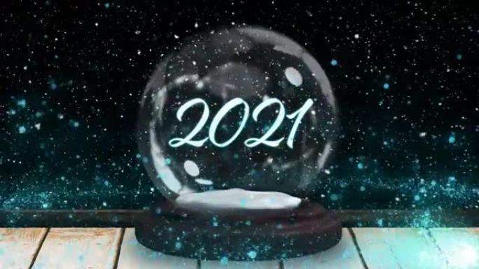 黑色背景下木质表面雪球中的2021文本周围流星