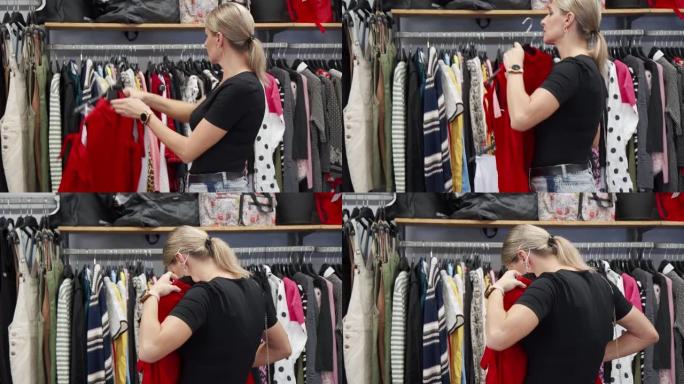 一个女人正在考虑在商店买衣服。她选择买哪件东西。背景中有许多不同的衣服挂在衣架上。