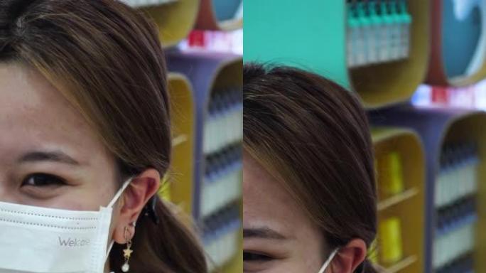 年轻的少女在美容院进行穿刺手术后检查耳朵