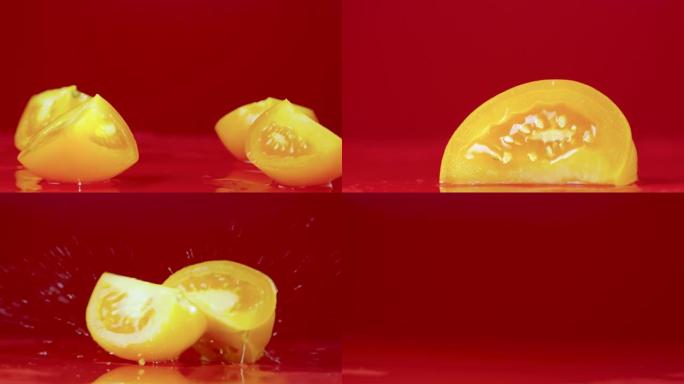 一组视频镜头成熟的黄色番茄片落在潮湿的反光桌面上。在红色工作室背景上飞溅的西红柿切片的特写镜头。番茄