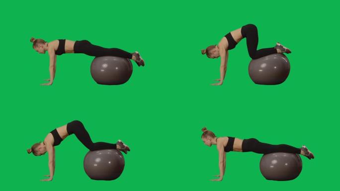 穿着运动服的年轻女子在健身球上扭动。锻炼手臂，背部肌肉和腹部，适合女性。绿色屏幕背景上的侧视图全长。