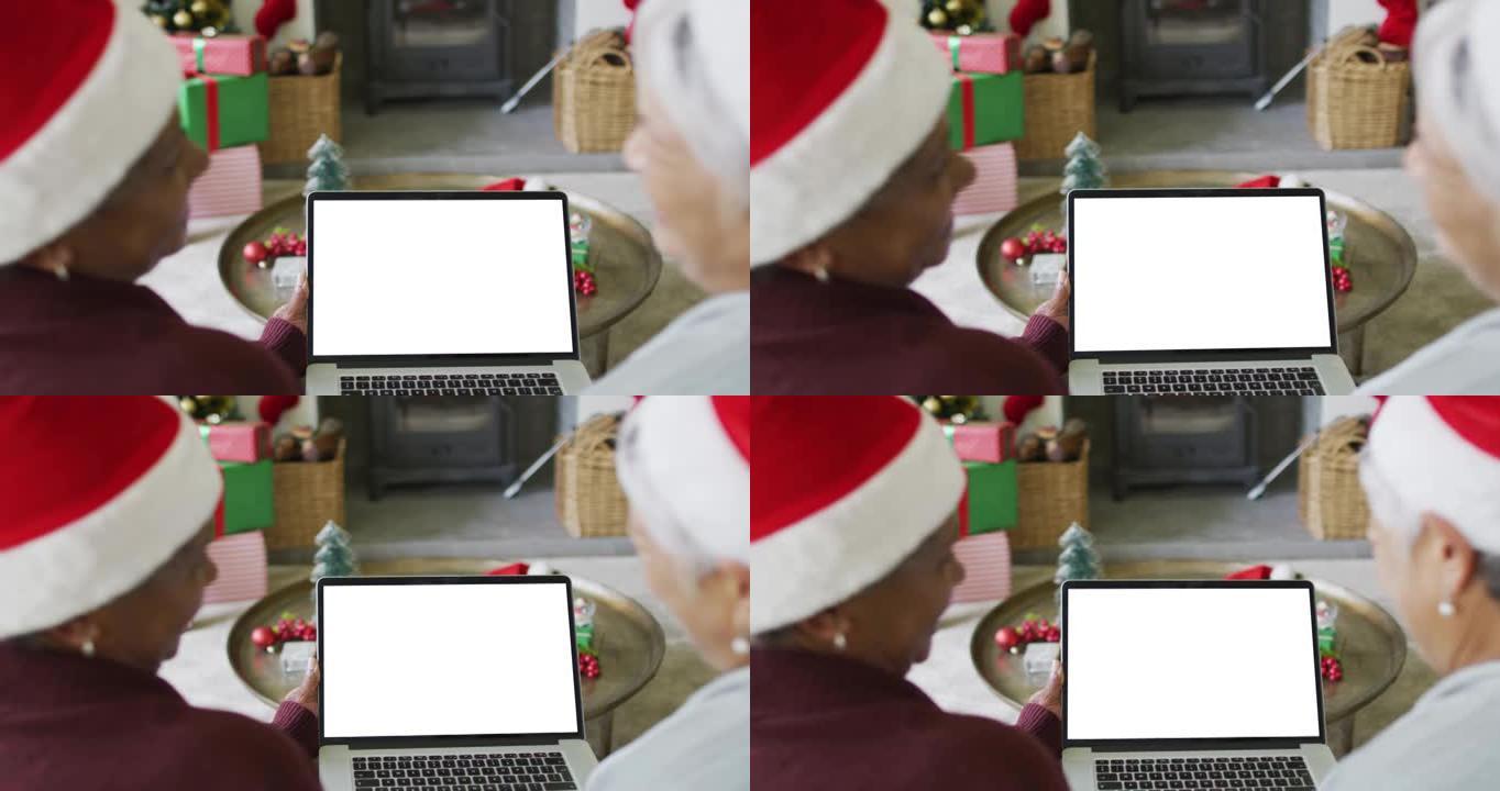 面带微笑的资深女性朋友进行笔记本电脑圣诞视频通话，屏幕上有复制空间