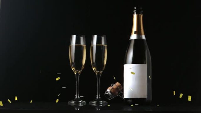 黑色背景上金色五彩纸屑掉落在香槟杯和瓶子上的动画