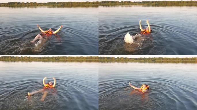 一个穿着救生衣的女人在水中游泳，在池塘里救了一个人