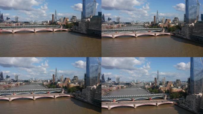 向前上升，飞越泰晤士河。逐渐露出横跨水域的桥梁和两岸的各种建筑物。城市里阳光明媚的一天。英国伦敦