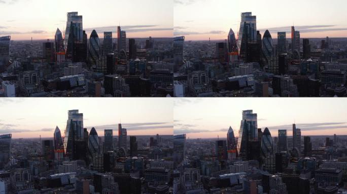 城市商业中心。日落后，现代玻璃覆盖了高大的标志性建筑。英国伦敦