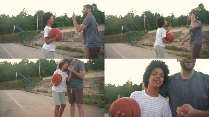 在他们一对一完成户外篮球比赛后，骄傲的父亲与他才华横溢的女儿交换了高五