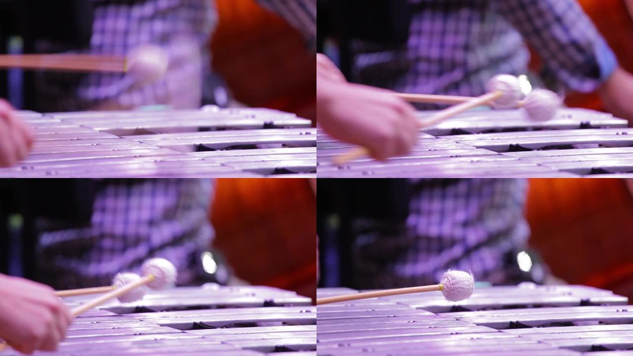 音乐家演奏木琴close-up.Xylophone的手，金属琴。