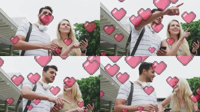 心脏图标的动画漂浮在快乐的高加索夫妇交谈和使用智能手机上