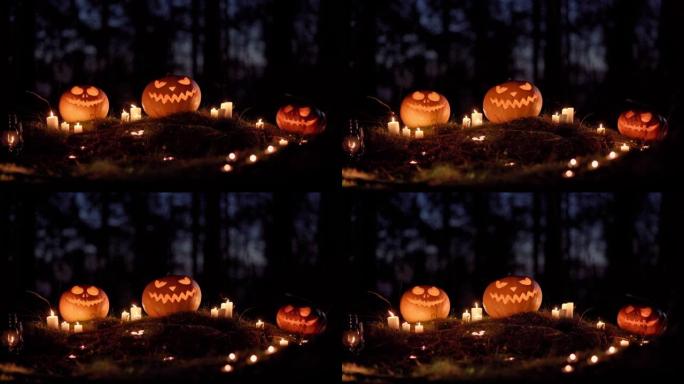 在黑暗的夜晚森林中，三个雕刻的南瓜灯南瓜和燃烧的蜡烛的特写镜头。传统节日符号。令人毛骨悚然的万圣节庆