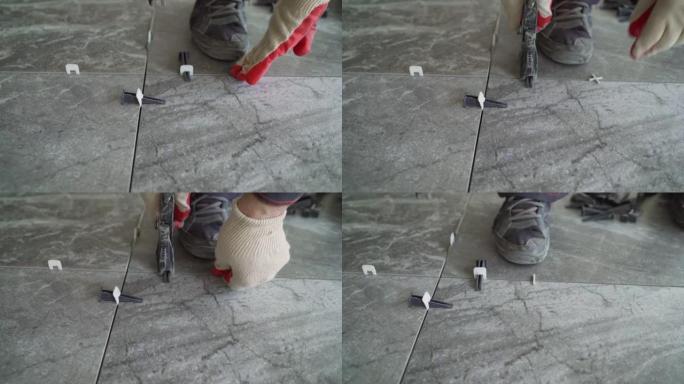 在施工或翻新过程中用于找平瓷砖的塑料十字架。地砖维修。安装用于将瓷砖固定在地板上的十字架
