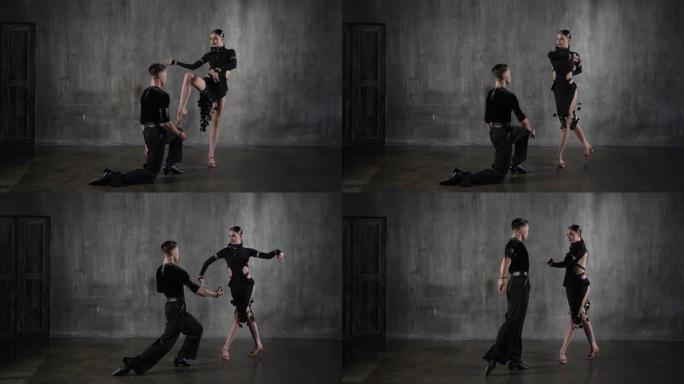 年轻优雅的千禧一代舞蹈舞厅夫妇穿着黑色连衣裙，在垃圾背景下以性感的姿势跳舞。