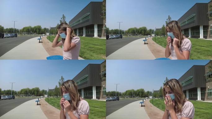 十几岁的女性坐在公立学校大楼外的公共汽车站，戴着口罩，执行任务，回到学校4k视频系列