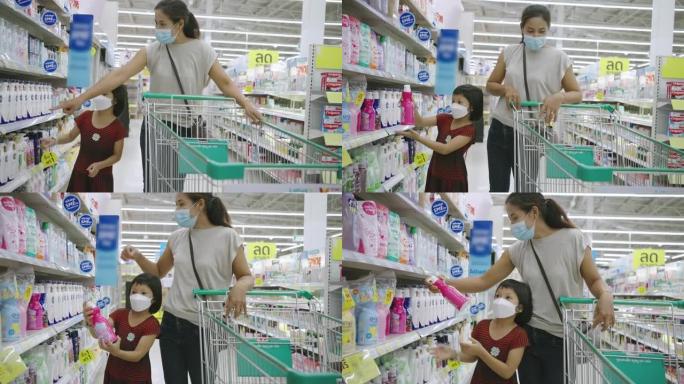 亚洲妇女和女儿在超市购物。