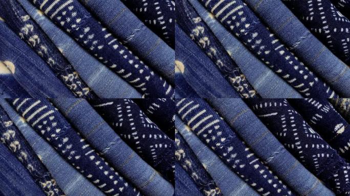 传统染色的折叠靛蓝棉织物的短纤维。牛津蓝、海军蓝布料、家居装饰纺织品。