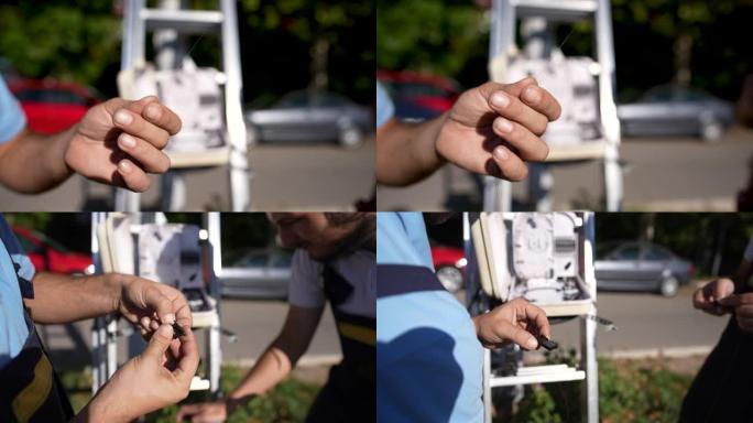 男性维修工程师的视频蒙太奇维修光学互联网的电气组件