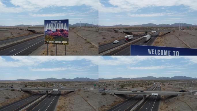4k无人机倾斜悬臂拍摄来自加州10号州际公路高速公路的亚利桑那州欢迎标志，卡车汽车和蓝色多云的天空