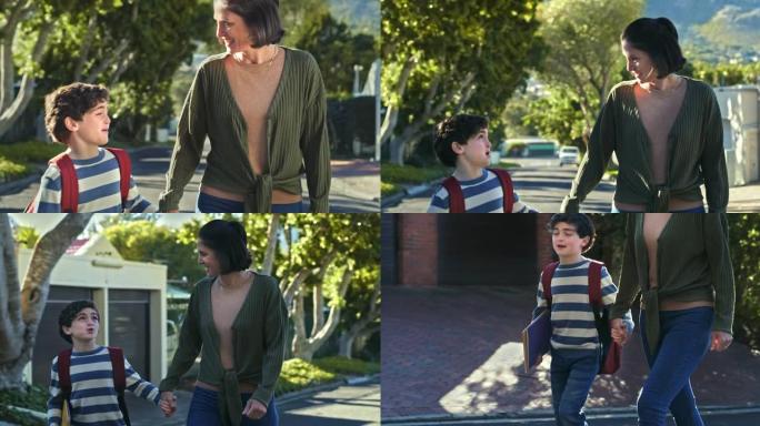 4k视频片段，一个小男孩在与母亲一起回家时戴着背包