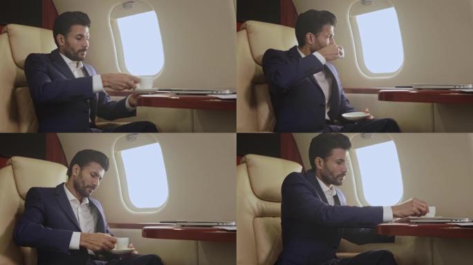 男子乘坐私人飞机，喝咖啡。