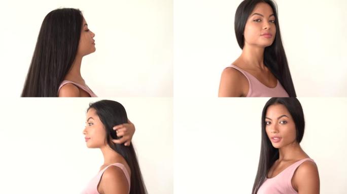 4k视频迷人的年轻亚洲黑发，长发在白色背景上说话和摆姿势，用于选角。