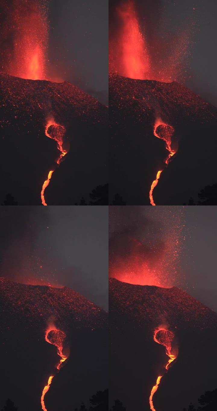 拉帕尔玛火山在黄昏爆发，熔岩流流动。惊人的声音!