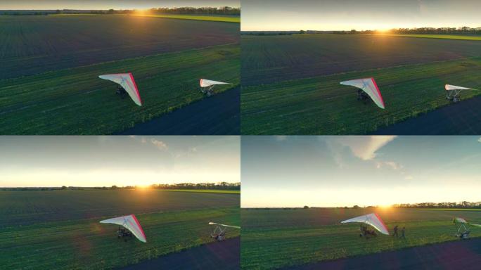 在草地跑道上着陆后的机动悬挂式滑翔机